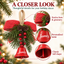 Classic Christmas hanging bell with red bow, greenery, berries and pinecones