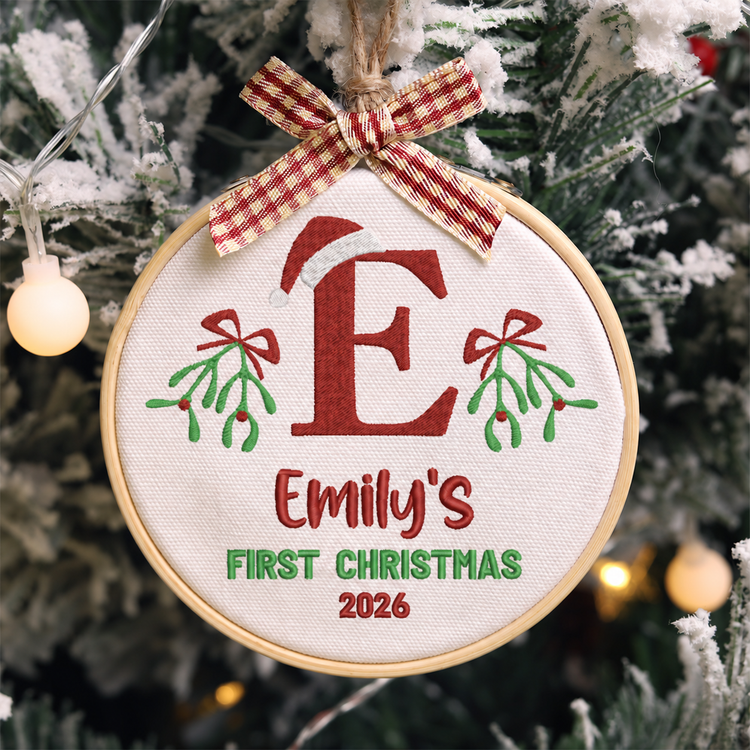 Personalized Embroidered Baby's First Christmas Ornament 2026 - Santa Hat Initial and Mistletoe - Image 1